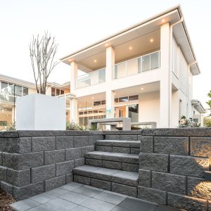 Steps and wall in built from charcoal coloured Heron blocks | Featured image for Heron Range.