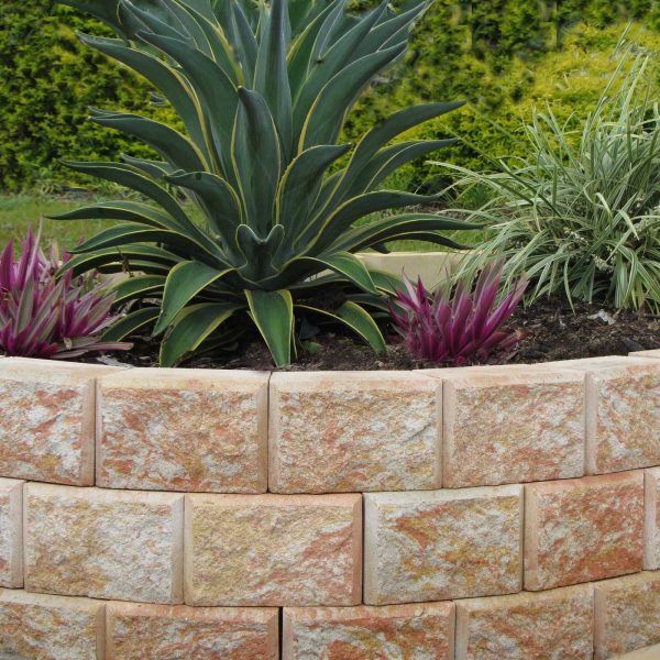 Front view of a stone wall garden edge | Featured Image for Bribie Garden Edge.