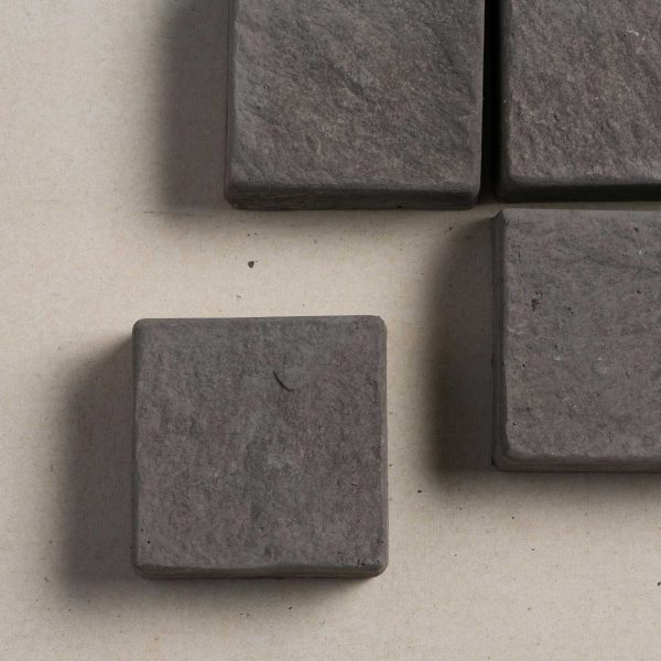 Top view of charcoal coloured cobblestone pavers | Featured image for Cobblestone Paver.