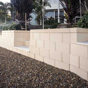 Front view of a wall constructed from limestone coloured Hayman blocks | Featured image for Hayman Range.