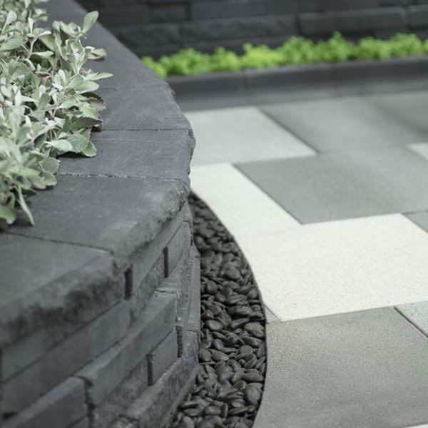 Zoomed in view of the edge of a low wall made from Natural Impressions Duostone blocks | Featured image for Natural Impressions Duostone.