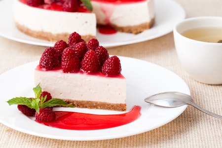 Cheesecake with berry sauce and mint herbs