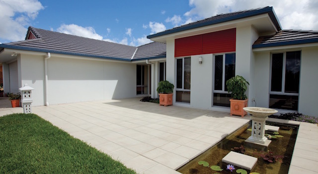 House with newly sealed pavers | Featured image for Benefits of Sealing Pavers: Why it is Important and Necessary blog for Centenary Landscaping.
