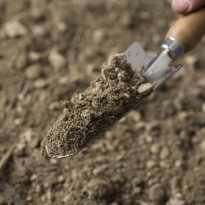 Photo of a garden spade digging in Podium Soil | Featured Image for Podium Soil Product Page by Centenary Landscape Supplies.