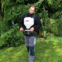 Photo of a man spreadng granular fertiliser over grass | Featured Image for Solo Granulate Spreaders 421 page by Centenary Landscaping Supplies.