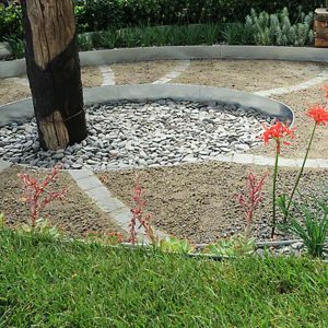 Photo of an outdoor garden area created with FormBoss Galvanised Steel Edging | Featured Image for FormBoss Galvanised Steel Edging product page by Centenary Landscaping Supplies.