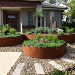 Photo of a round garden bed with plants in them created with FormBoss REDCOR Steel Edging.